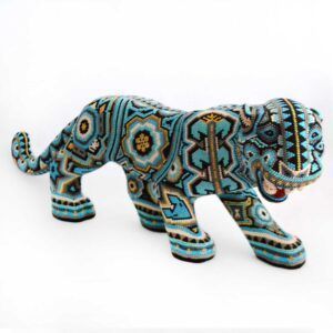 Jaguar huichol azul: fuerza mística, protección ancestral, arte vibrante, tradición viva.